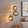 Wandleuchte Koyoto mit drei runden Rauchglasschirmen und Lichteffekt an der Wand